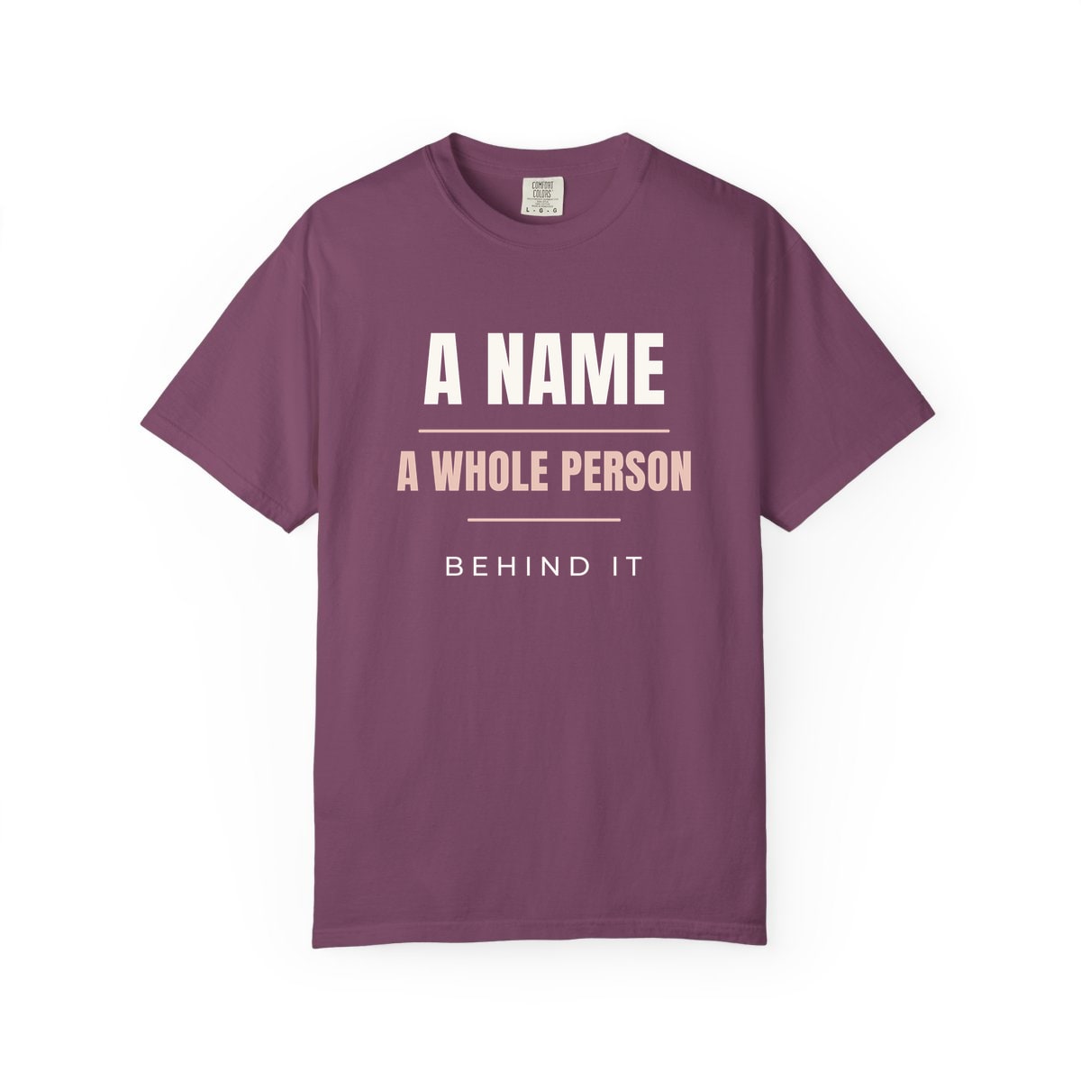 A Whole Person Behind It, printed on a Comfort Colors garment-dyed t-shirt in Berry