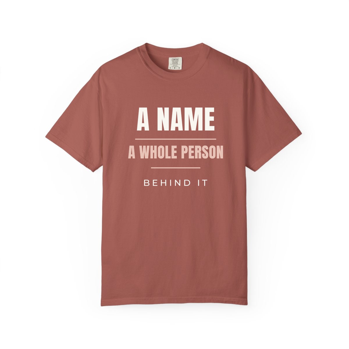 A Whole Person Behind It, printed on a Comfort Colors garment-dyed t-shirt in Cumin