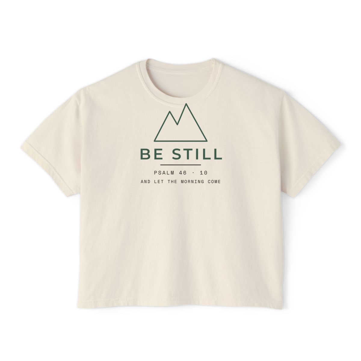 Be Still, Small Type, printed on a boxy tee in Ivory