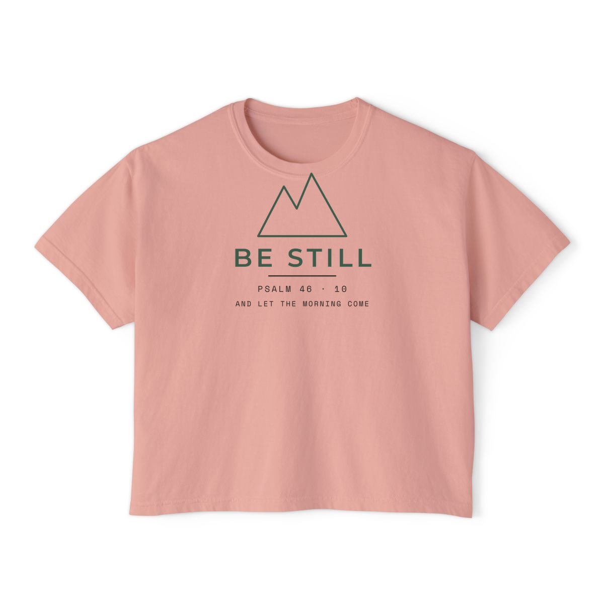 Be Still, Small Type, printed on a boxy tee in Peachy