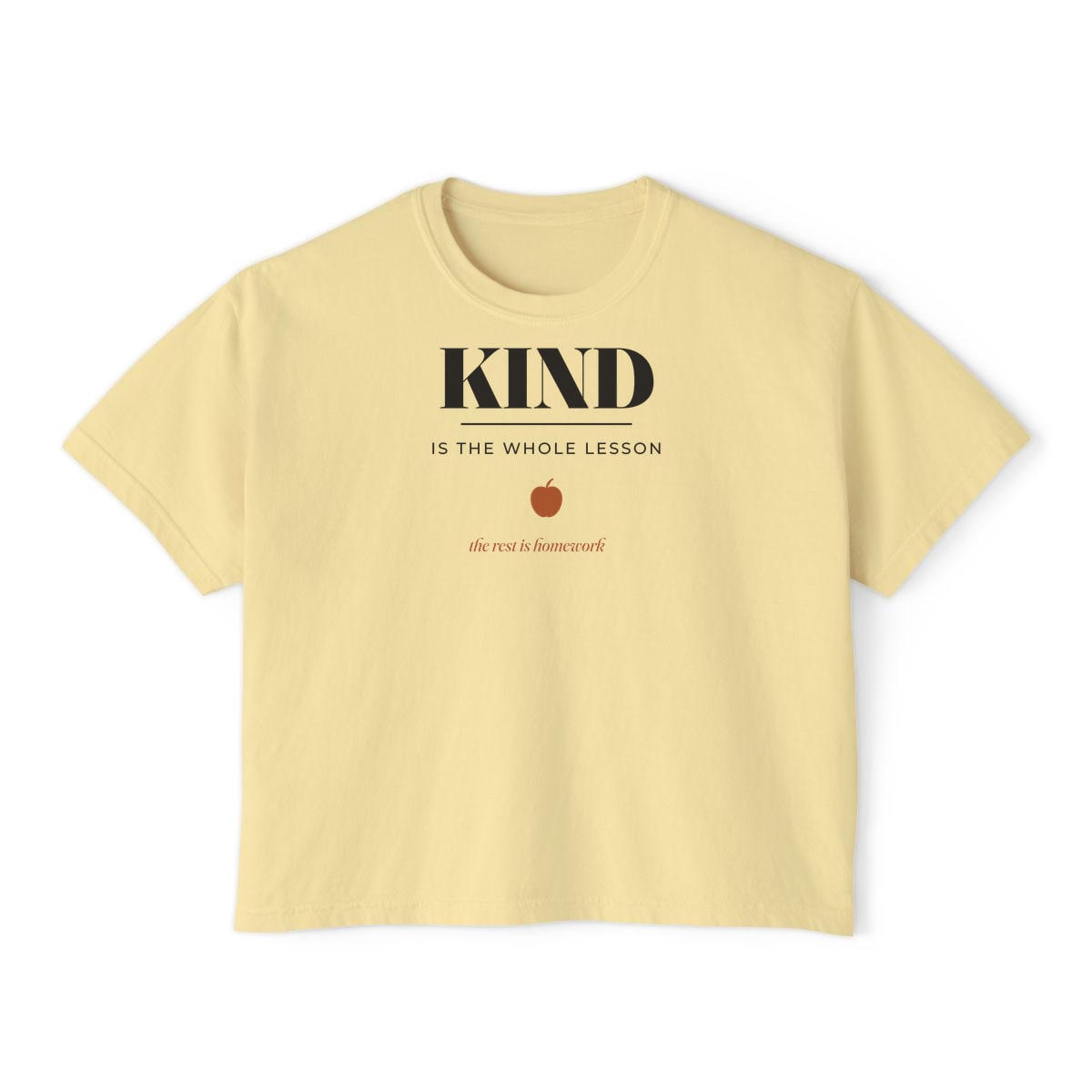 Kind Is The Whole Lesson, printed on a boxy tee in Butter