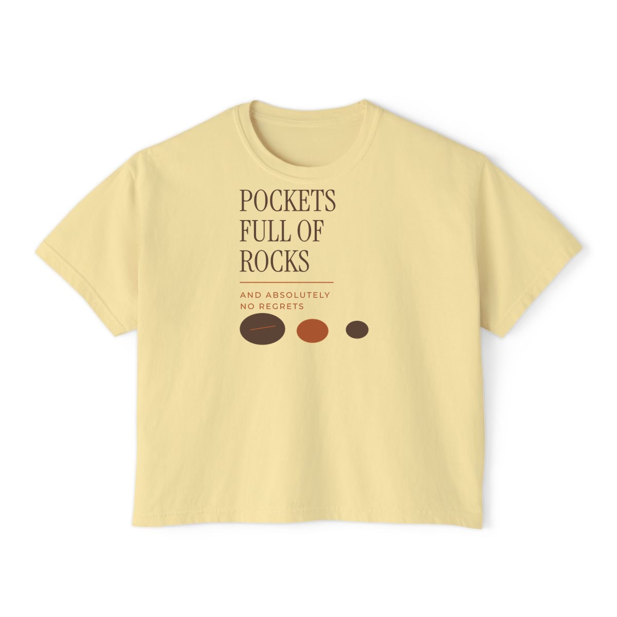 Pockets Full Of Rocks, printed on a boxy tee in Butter