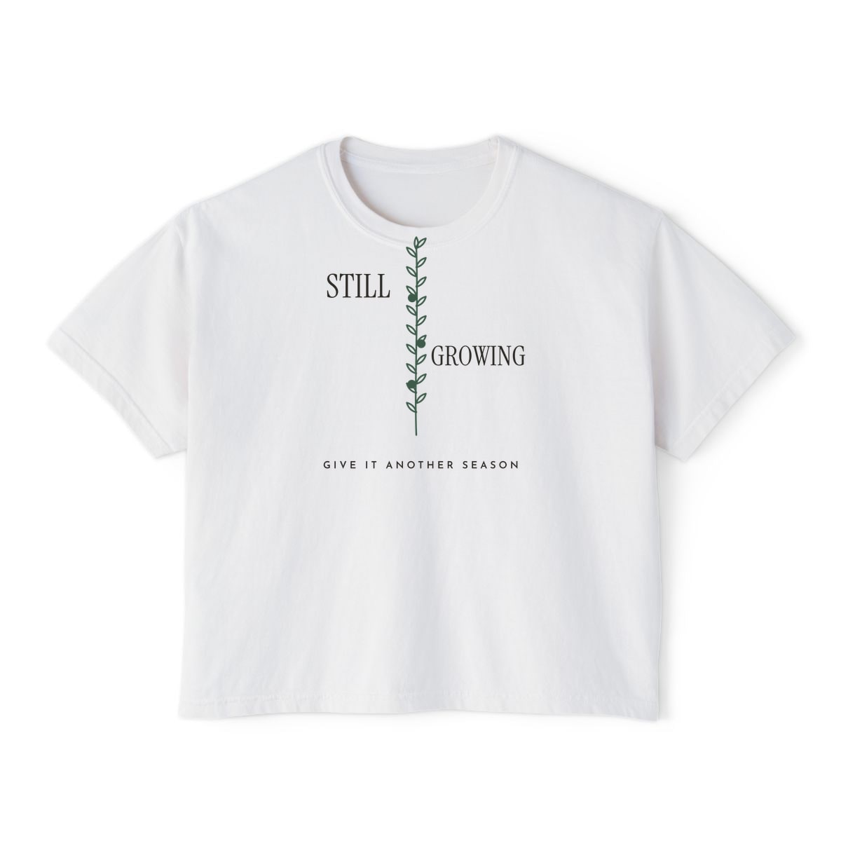 Still Growing Olive Branch, printed on a boxy tee in White