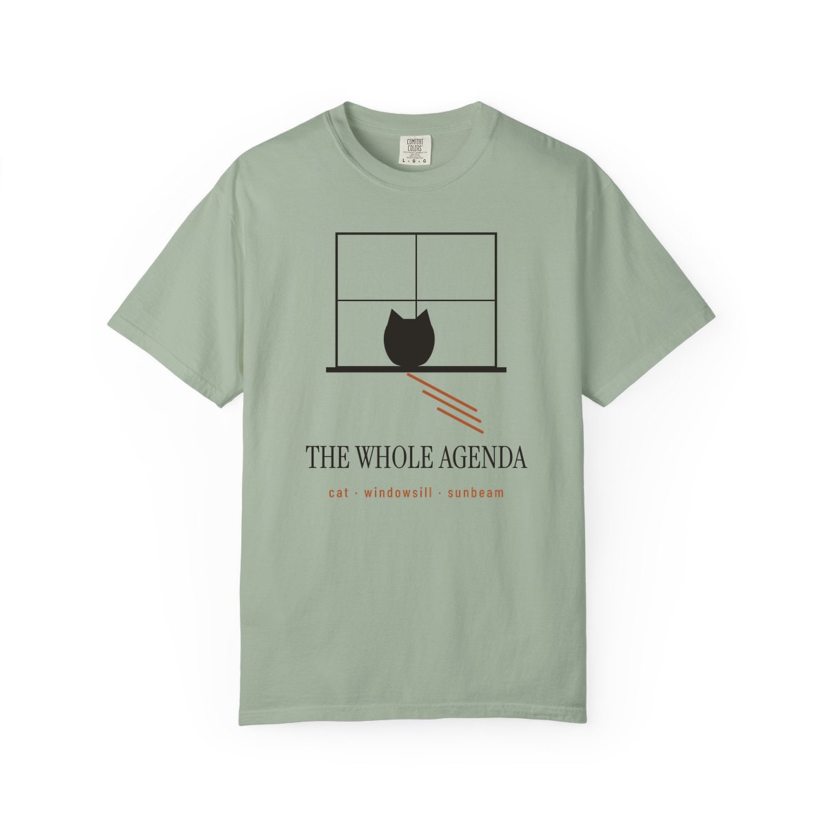 Cat, Windowsill, Sunbeam, printed on a Comfort Colors garment-dyed t-shirt in Bay