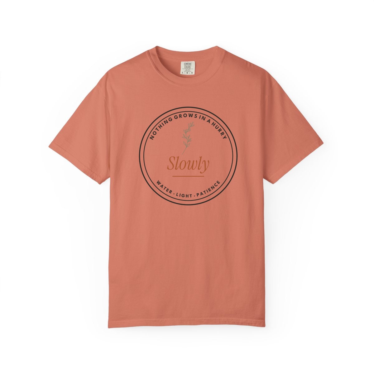Nothing Grows In A Hurry, printed on a Comfort Colors garment-dyed t-shirt in Terracotta