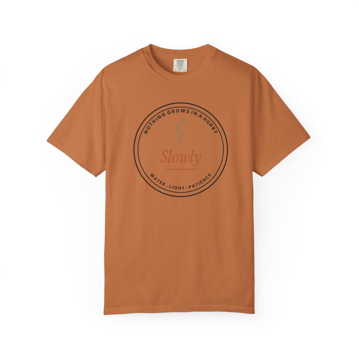 Nothing Grows In A Hurry, printed on a Comfort Colors garment-dyed t-shirt in Yam