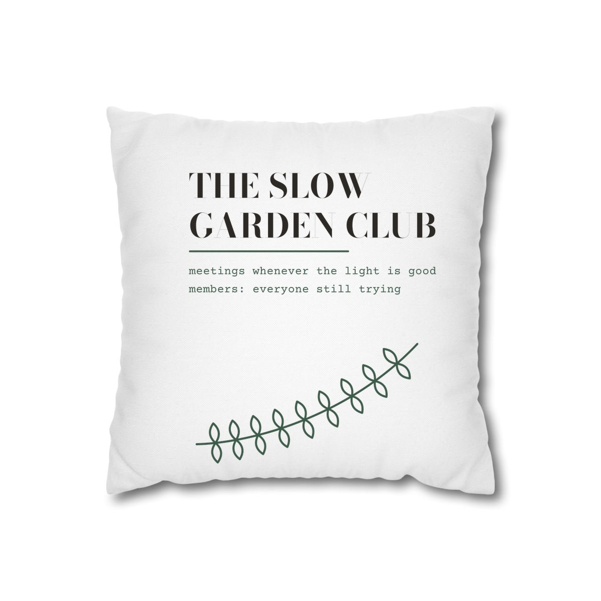 The Slow Garden Club, printed on a cushion cover in White