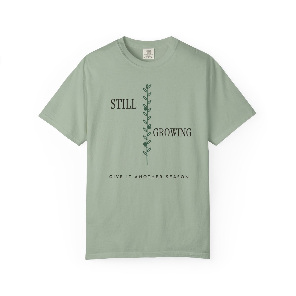 Still Growing Olive Branch, printed on a Comfort Colors garment-dyed t-shirt in Bay