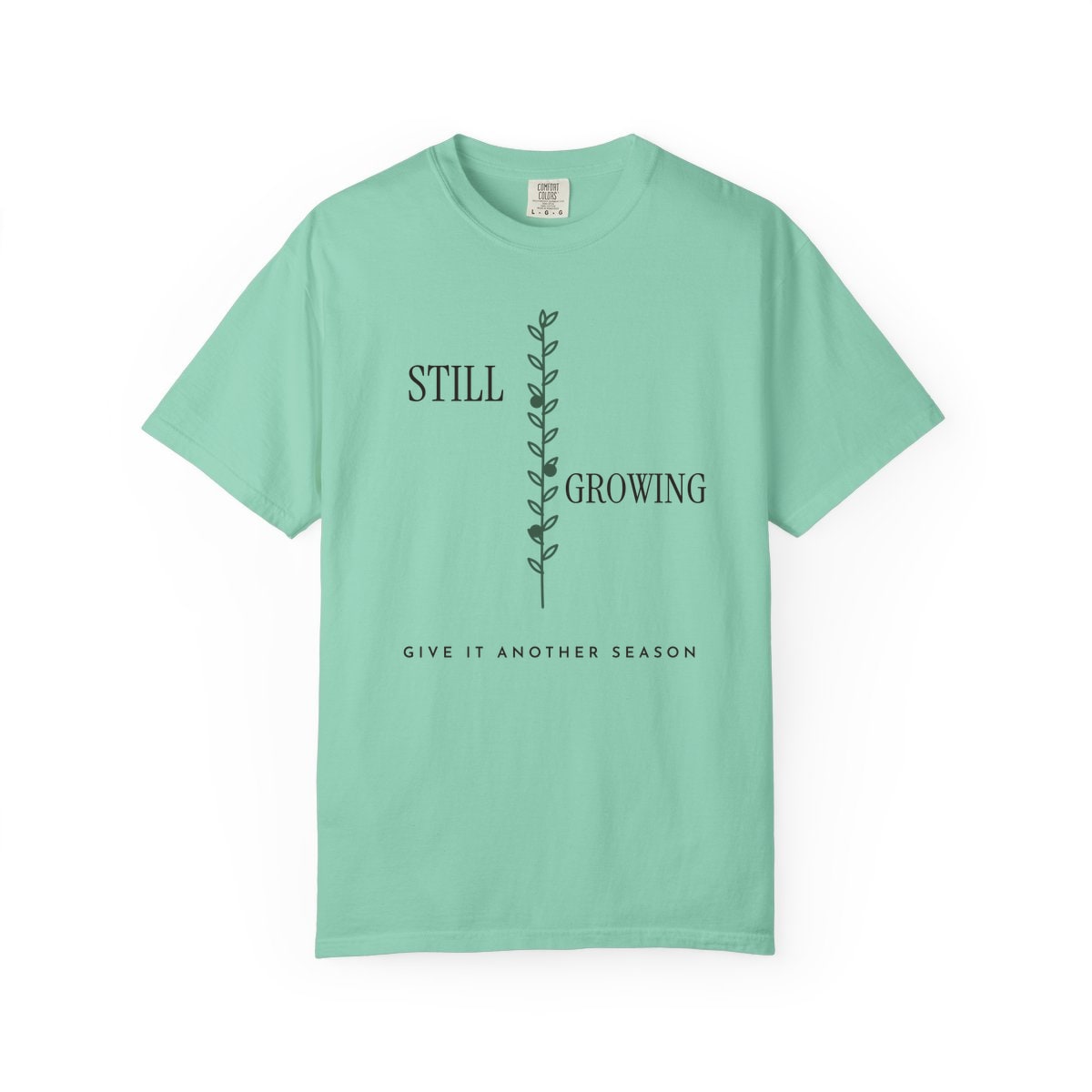 Still Growing Olive Branch, printed on a Comfort Colors garment-dyed t-shirt in Island Reef