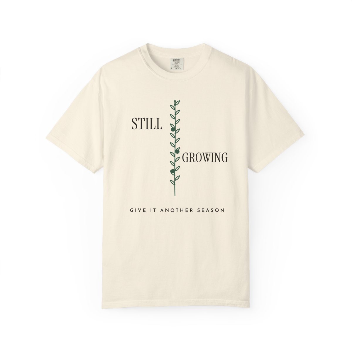 Still Growing Olive Branch, printed on a Comfort Colors garment-dyed t-shirt in Ivory